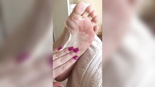 Rubbing some lotion on my feet - Feet