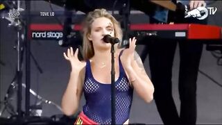 Drunk: Singer undresses topless on stage