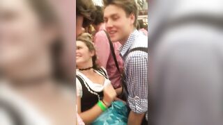 Oktoberfest in Germany - The guy is looking for something under the skirt of a girl!