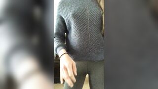 stripping out of her leggings and pretty blue sweater - WOW!